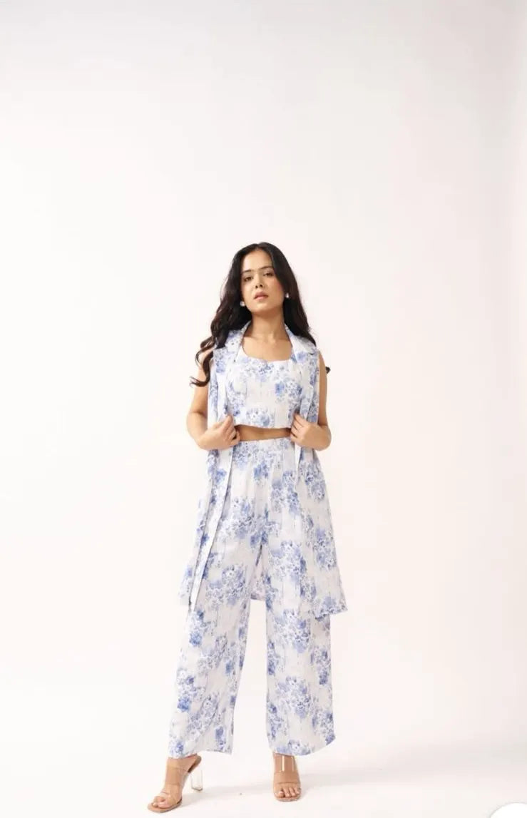 Woman wearing a blue floral dress on a white background