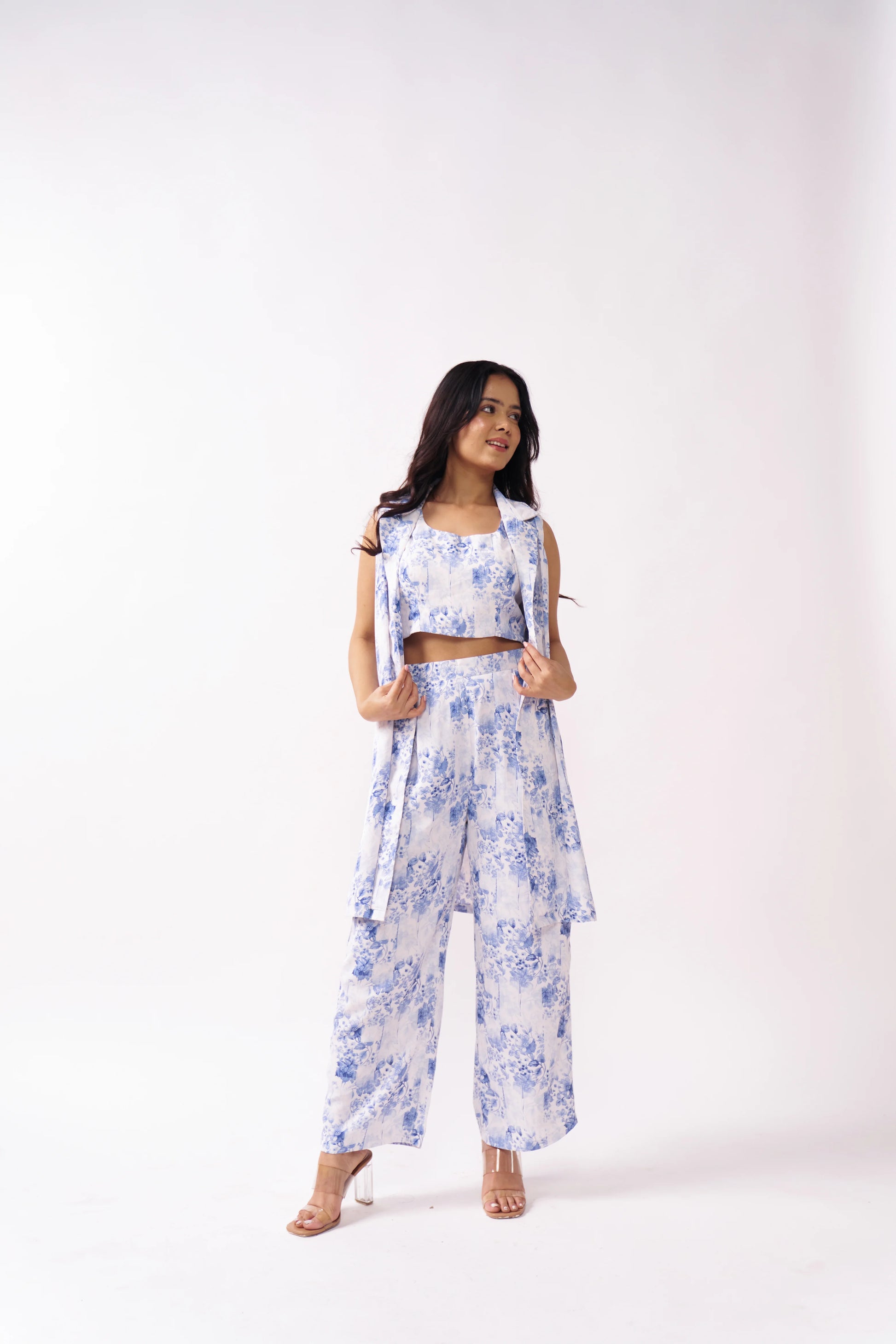 Woman wearing a floral outfit on a white background