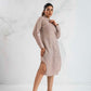 Woman wearing a beige dress against a white background